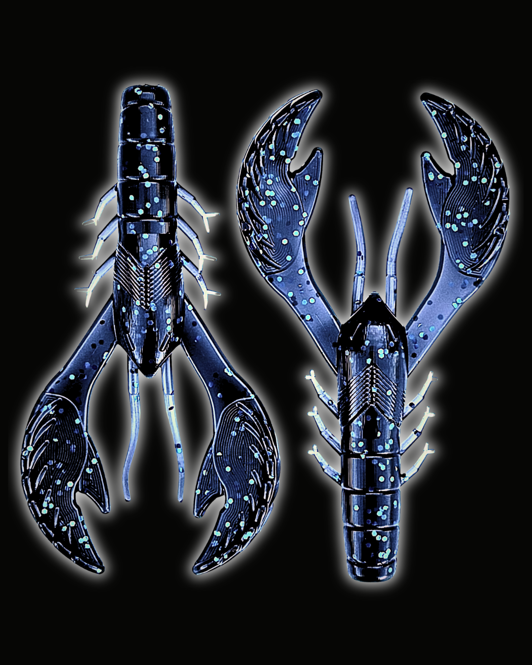 Two Okie Angler Co 4" Okie Craws in the color Okie Midnight (dark blue with blue sparkles) - crawfish-style bass fishing lures on a black background.
