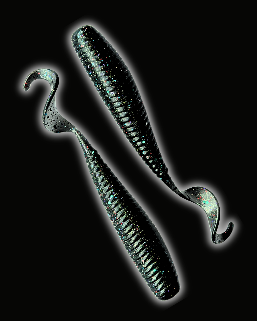 Okie Angler Co Space Candy 5" Okie Stud ribbed curl-tail soft plastic fishing lures on a black background.
