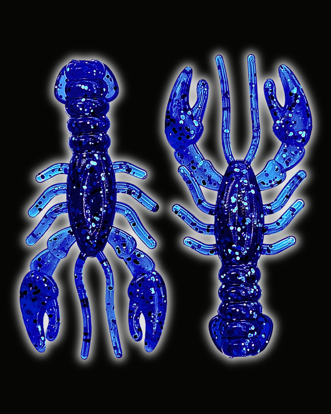 Two Okie Angler Co 3.4" Glory Craws in the color Nightfall Blue - crawfish-style fishing lures on a black background.