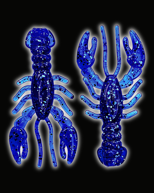 Two Okie Angler Co 3.4" Glory Craws in the color Nightfall Blue - crawfish-style fishing lures on a black background.