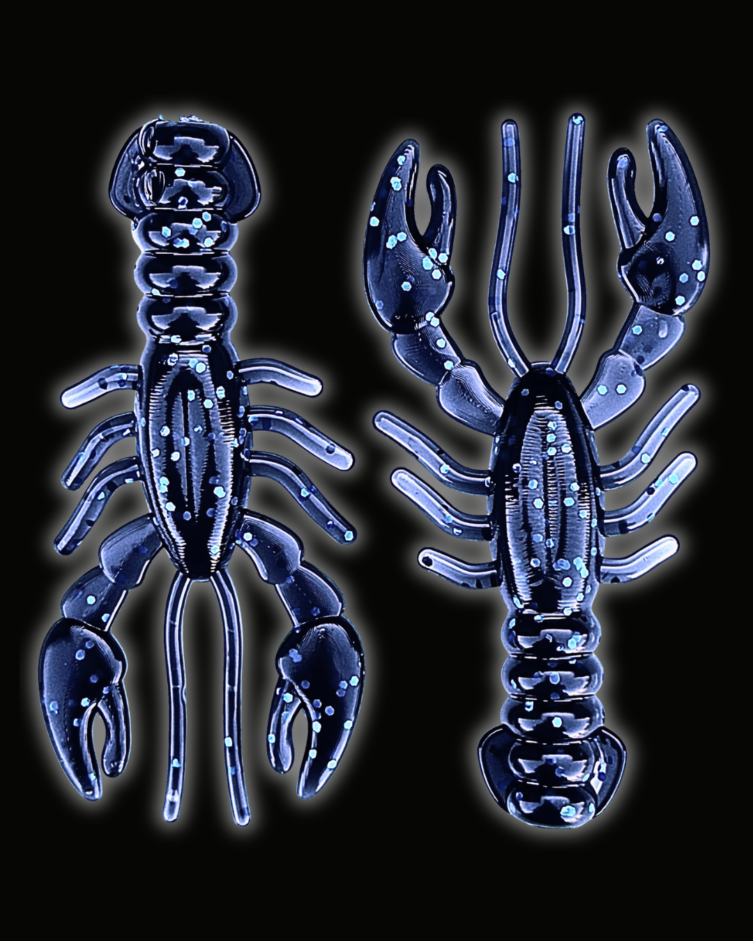 Two Okie Angler Co 3.4" Glory Craws in the color Okie Midnight (dark blue with blue sparkles) - crawfish-style fishing lures on a black background.