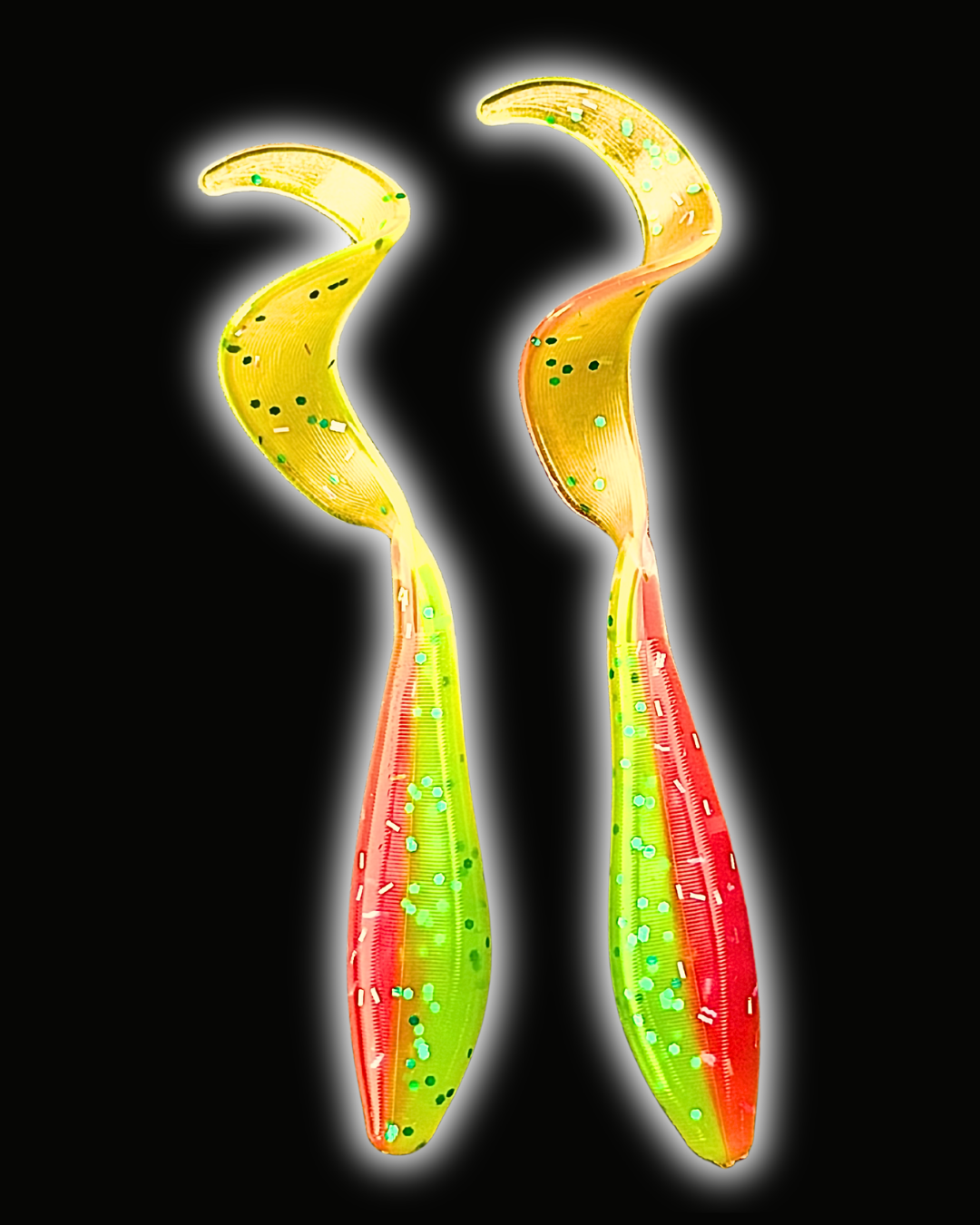 Two Okie Angler Co 3.5" Okie Twisters in Livewire - a compact paddle-tail swimbait on a black background.