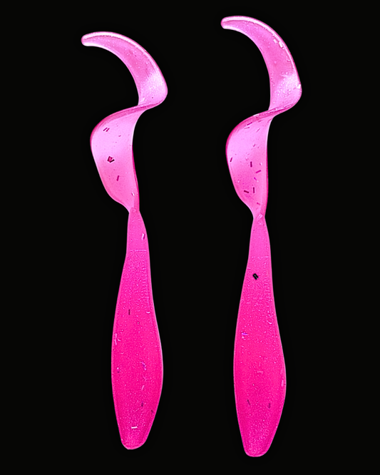 Two Okie Angler Co 3.5" Okie Twisters in Prizm Pink - a compact paddle-tail swimbait on a black background.