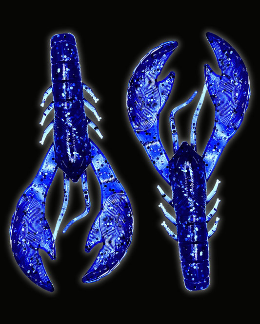 Two Okie Angler Co 4" Okie Craws in the color Nightfall Blue - crawfish-style bass fishing lures on a black background.
