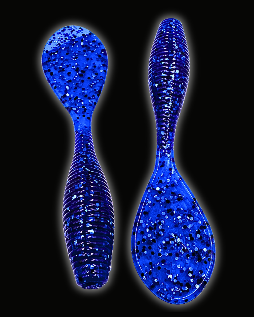 Okie Angler Co Nightfall Blue 4" Paddle Grub ribbed, paddle-tail soft plastic fishing lures on a black background.