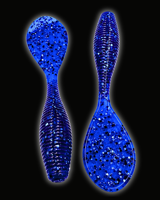 Okie Angler Co Nightfall Blue 4" Paddle Grub ribbed, paddle-tail soft plastic fishing lures on a black background.