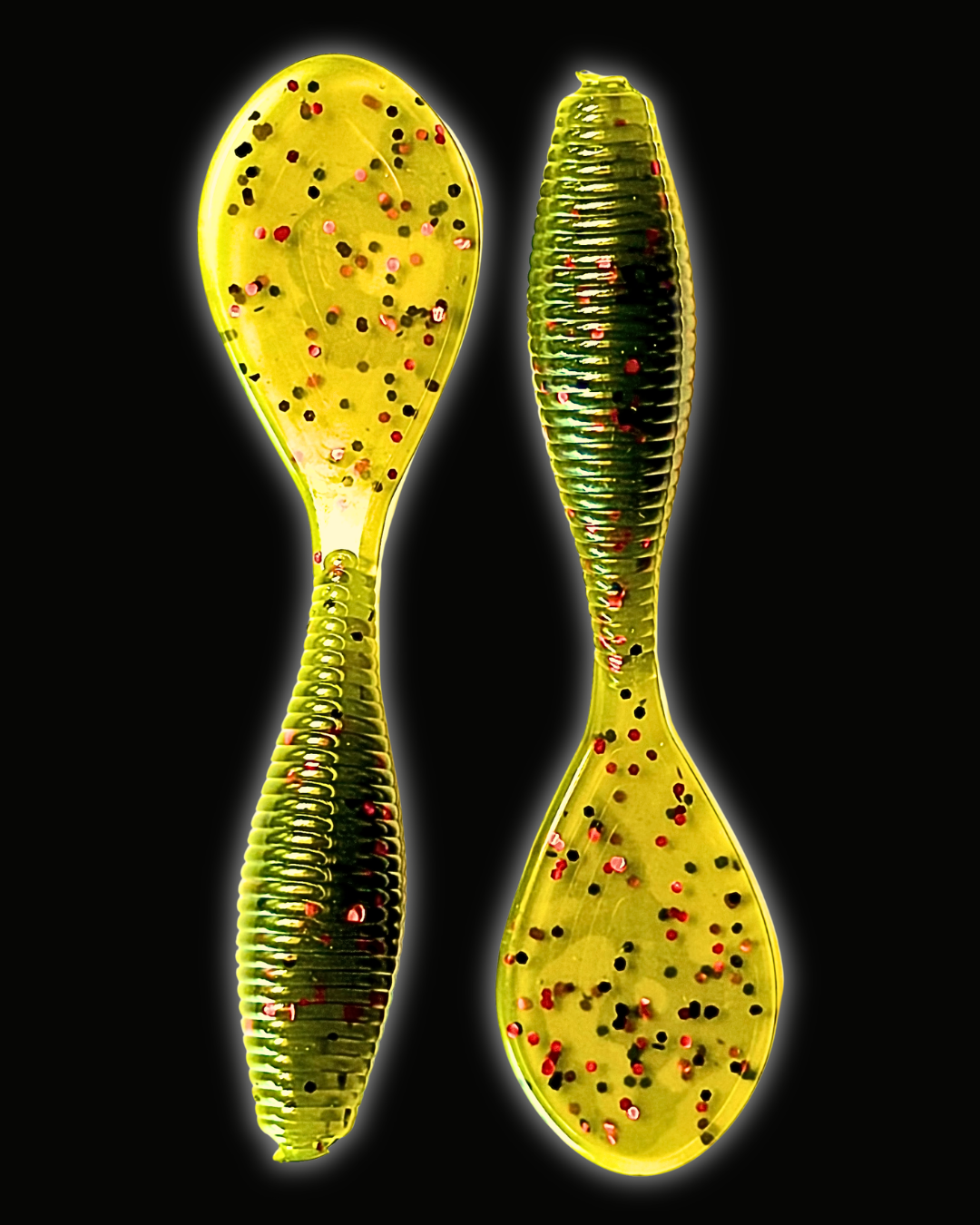 Okie Angler Co Watermelon Red 4" Paddle Grub ribbed, paddle-tail soft plastic fishing lures on a black background.