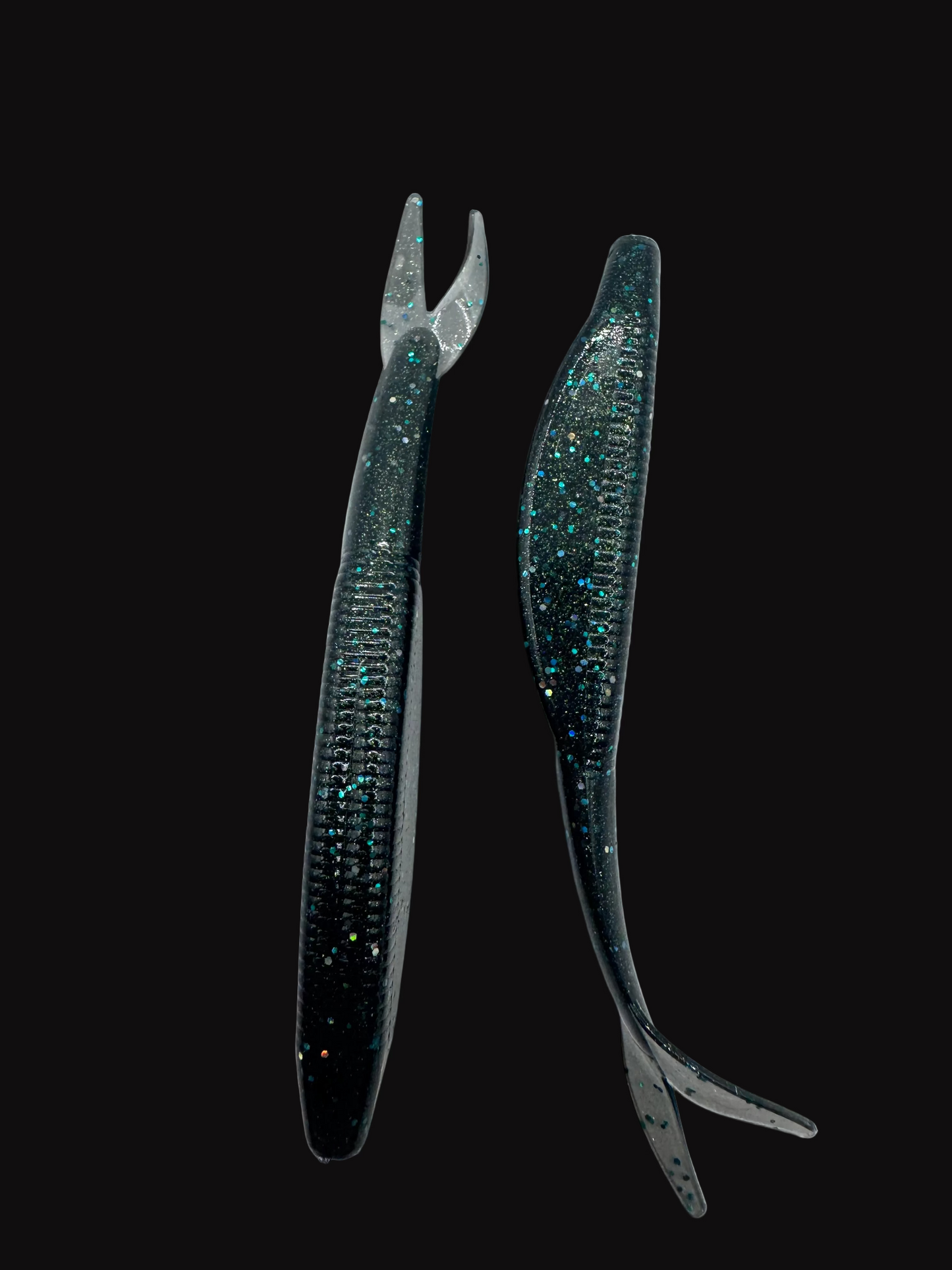 Two black fishing lures with glittery accents on a white background
